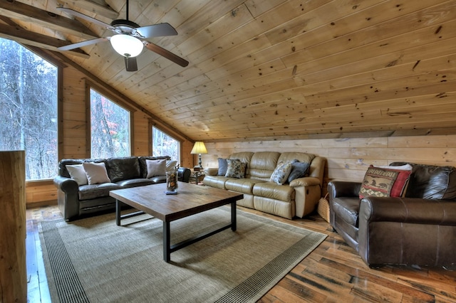 living room featuring lofted ceiling, wooden ceiling, wooden walls, hardwood / wood-style flooring, and ceiling fan