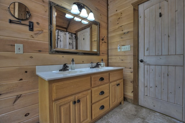 bathroom featuring a shower with curtain, tile patterned floors, vanity, and wood walls