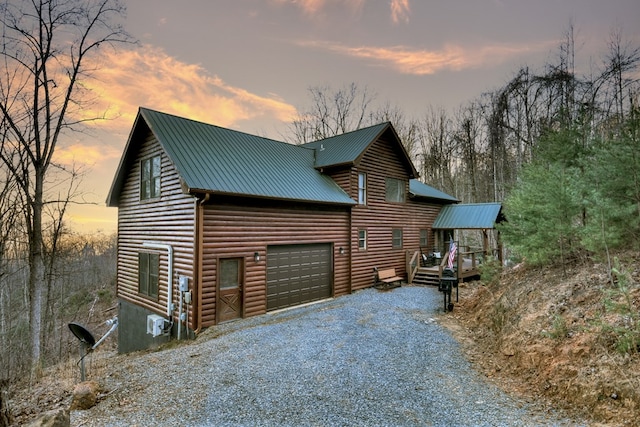 property exterior at dusk with a garage