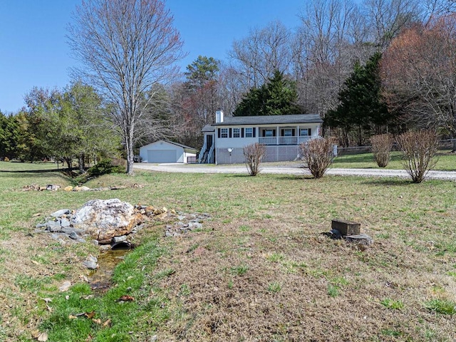 25 Winchester Woods Dr, Murphy, NC 28906 - view of yard with a porch, an outdoor structure, and a detached garage