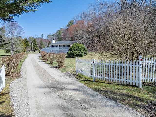 view of road featuring a gated entry and driveway