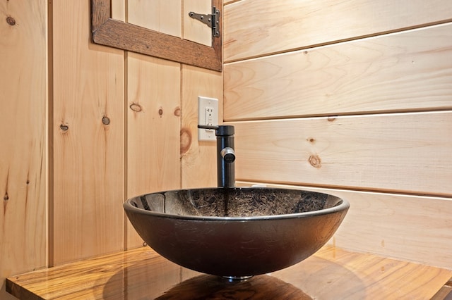 interior details with wood walls and sink