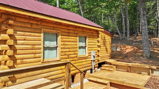 view of home's exterior with a wooden deck