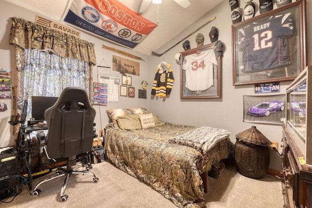 carpeted bedroom featuring lofted ceiling and ceiling fan