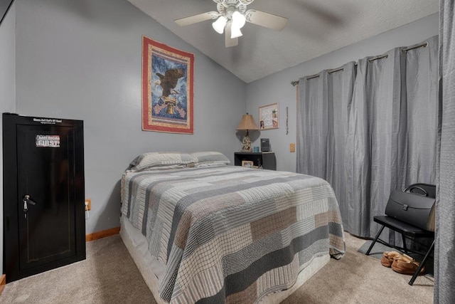 carpeted bedroom featuring vaulted ceiling, baseboards, and ceiling fan