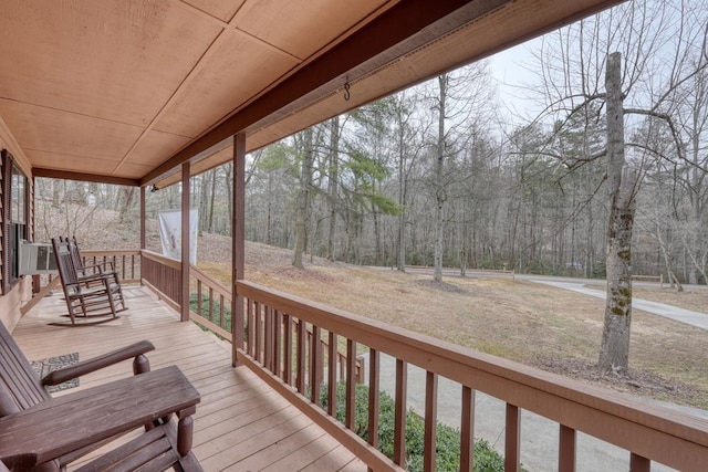 wooden terrace with a porch