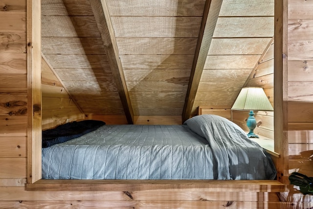 bedroom featuring wood walls