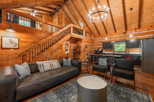 living area with stairway, wooden ceiling, wooden walls, and wood finished floors