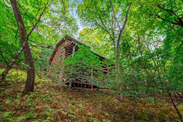 exterior space with a forest view