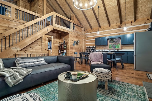 living room with wood ceiling, stairway, dark wood-style flooring, beamed ceiling, and wood walls