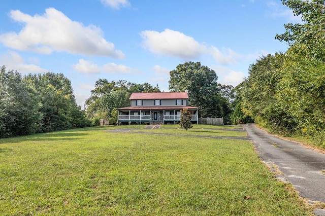 view of front of home with a front lawn and covered porch