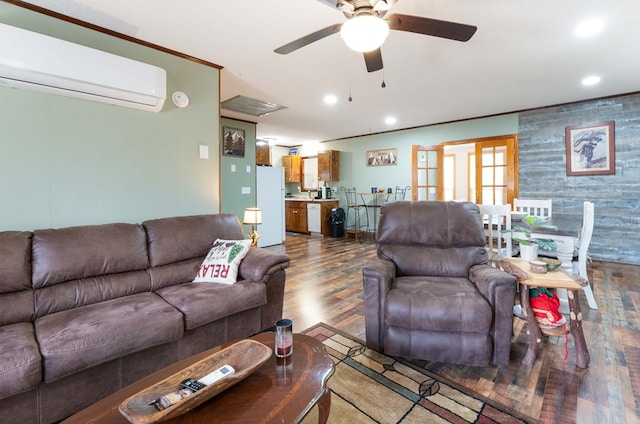 living area with dark wood finished floors, a wall mounted air conditioner, a ceiling fan, and recessed lighting