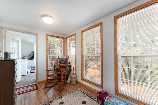 interior space featuring wood finished floors and baseboards