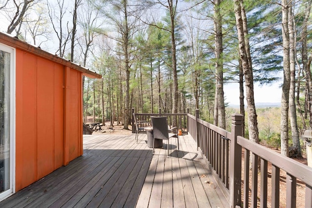 wooden deck with outdoor dining area
