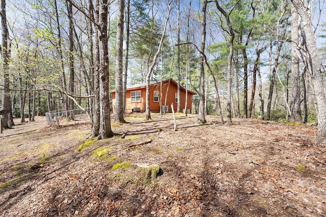 exterior space with a wooded view