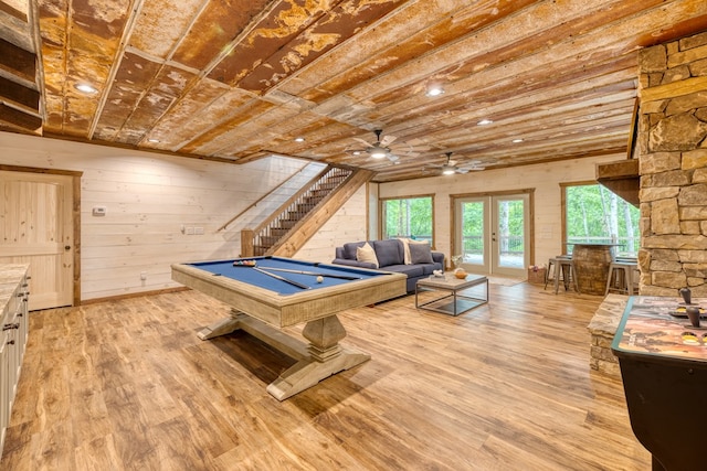 recreation room with ceiling fan, french doors, wood-type flooring, wood ceiling, and pool table