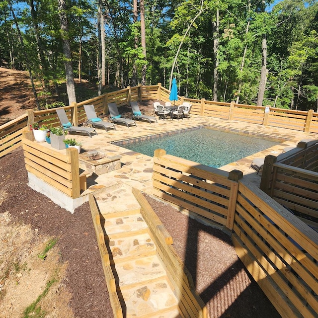 view of swimming pool featuring a patio area