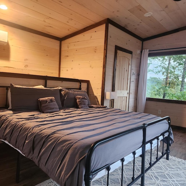 bedroom with wooden walls, hardwood / wood-style floors, wood ceiling, and lofted ceiling