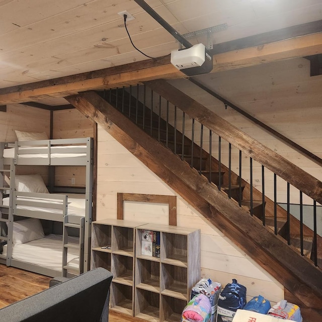 interior space featuring hardwood / wood-style flooring and wood walls