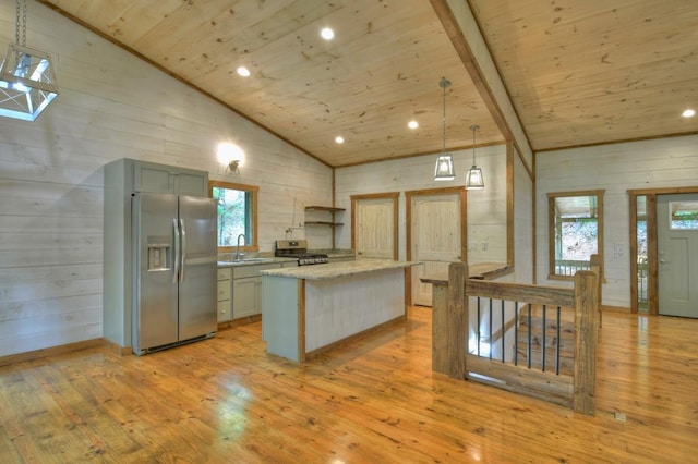 kitchen featuring wooden ceiling, hanging light fixtures, light wood-type flooring, light stone countertops, and stainless steel appliances