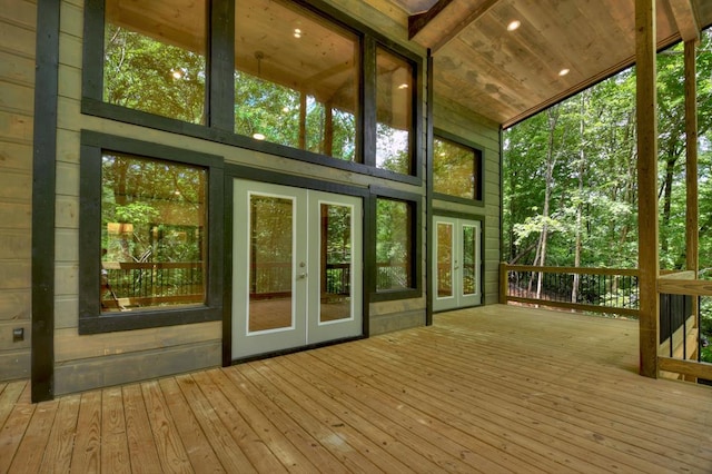 unfurnished sunroom with french doors, wooden ceiling, and lofted ceiling