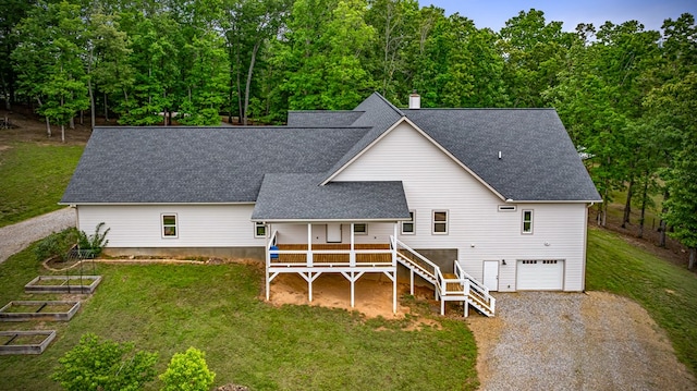 135 Adams Farm Dr, Blairsville, GA 30512 - rear view of property with a shingled roof, driveway, a vegetable garden, and a yard