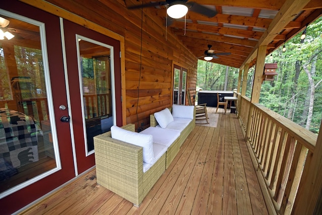 deck featuring an outdoor living space and ceiling fan