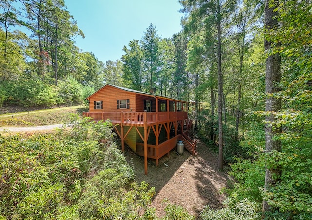 back of house with a wooden deck