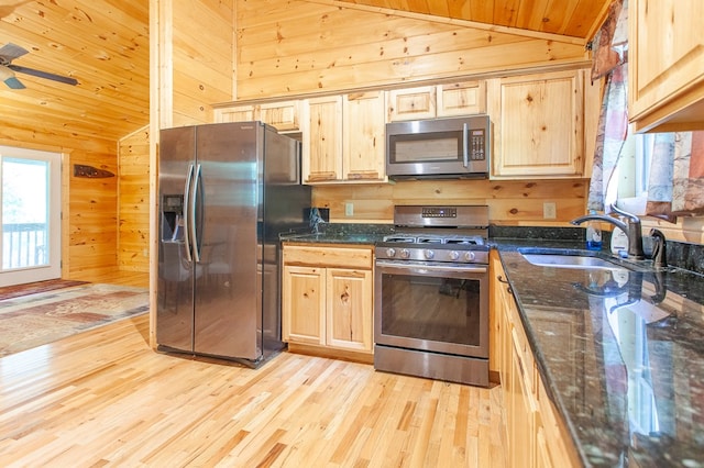 kitchen with light wood-type flooring, wood ceiling, stainless steel appliances, sink, and ceiling fan