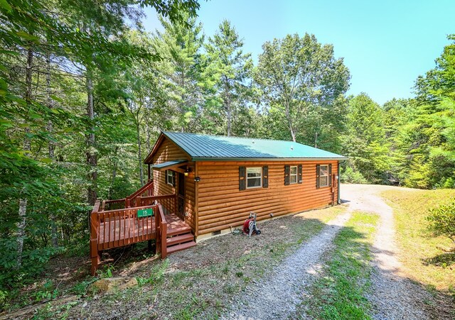 log home featuring a deck