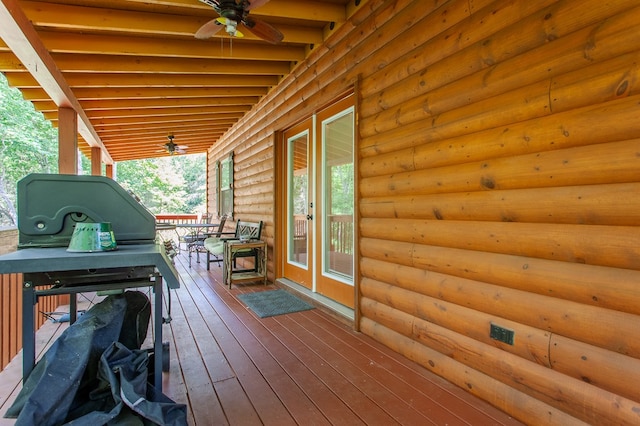 deck featuring ceiling fan and french doors