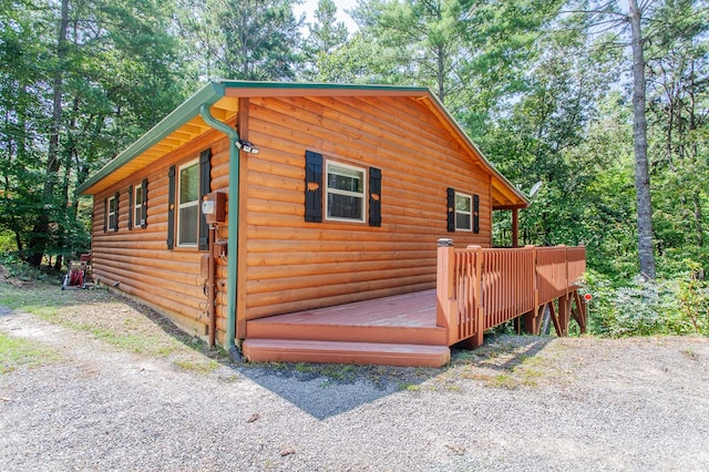 view of property exterior featuring a deck