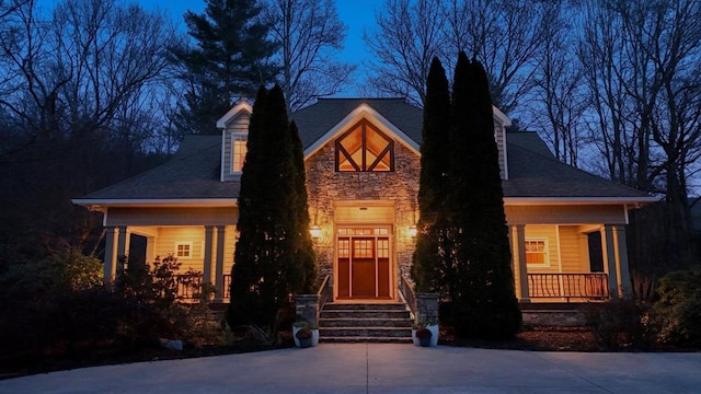 1949 Big Pine Dr, Hiawassee, GA 30546 - view of front of house featuring stone siding, a porch, and roof with shingles
