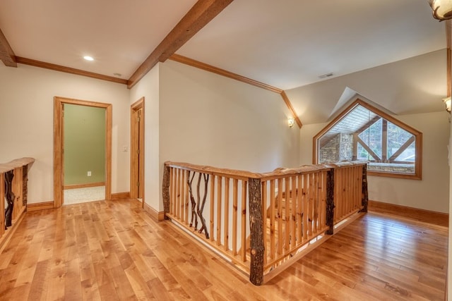 hall with beamed ceiling, light hardwood / wood-style floors, and crown molding