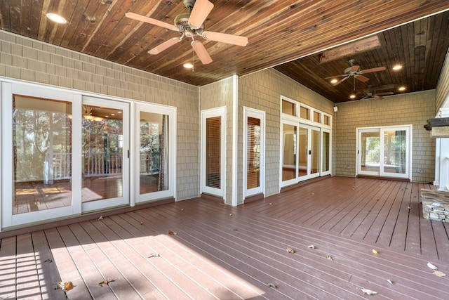 wooden deck featuring ceiling fan