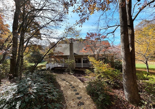 view of side of home featuring a porch