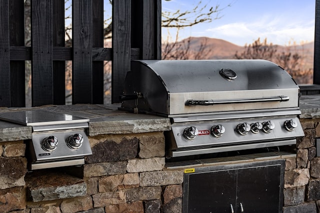 view of patio / terrace featuring area for grilling and a mountain view