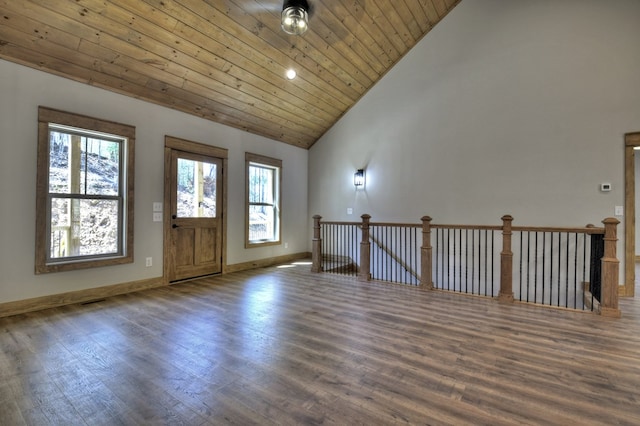 foyer featuring wooden ceiling, plenty of natural light, and wood finished floors