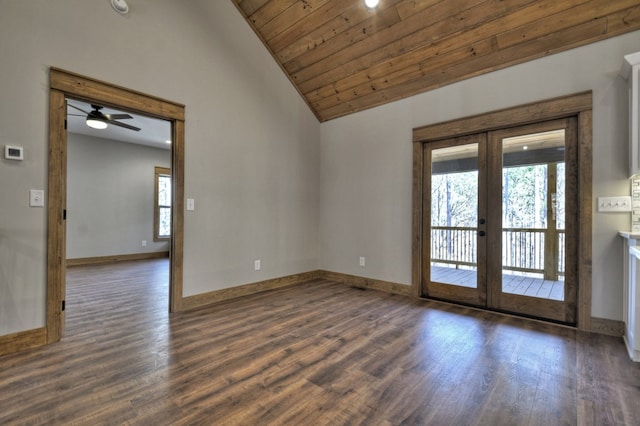 unfurnished room featuring french doors, lofted ceiling, baseboards, and wood finished floors