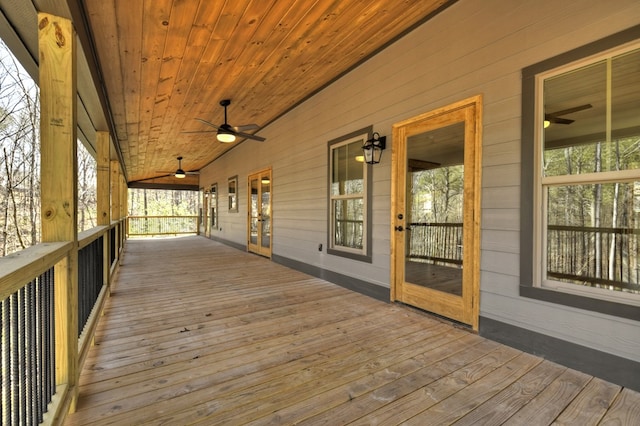 wooden terrace featuring a ceiling fan