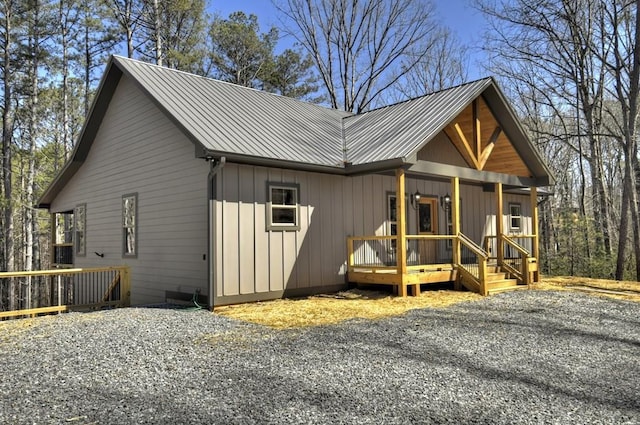 exterior space with covered porch and metal roof