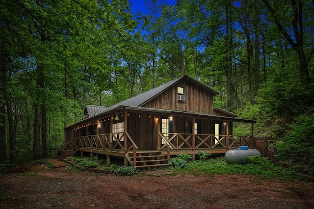 85 Clear Lake Ct, Ellijay, GA 30540 - rear view of house featuring metal roof and a forest view
