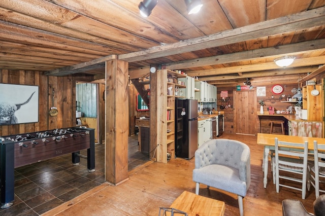 85 Clear Lake Ct, Ellijay, GA 30540 - basement featuring freestanding refrigerator, wood walls, and wood ceiling