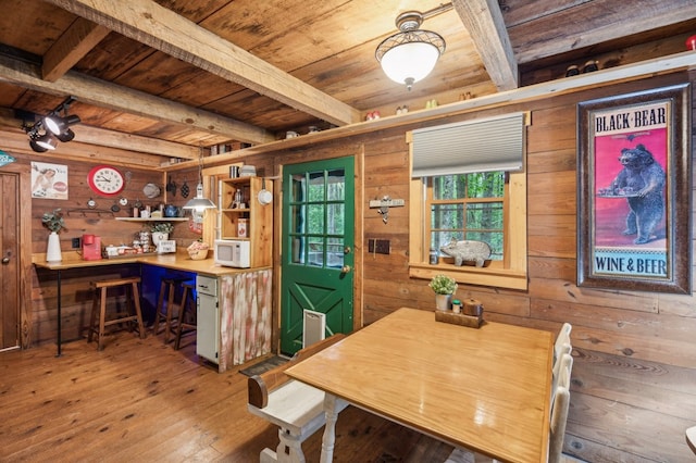 85 Clear Lake Ct, Ellijay, GA 30540 - dining space with wooden ceiling with exposed beams, wooden walls, and wood-type flooring