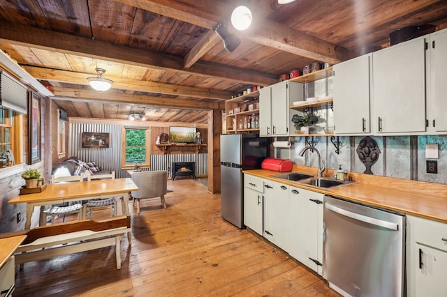 85 Clear Lake Ct, Ellijay, GA 30540 - kitchen featuring appliances with stainless steel finishes, a sink, open shelves, wood ceiling with exposed beams, and light wood-style floors