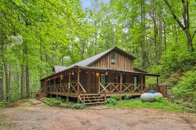 85 Clear Lake Ct, Ellijay, GA 30540 - view of front of home with metal roof and a view of trees