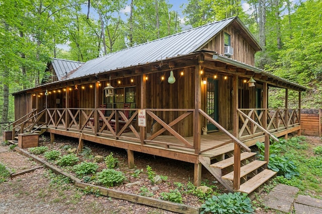 85 Clear Lake Ct, Ellijay, GA 30540 - back of house featuring metal roof and board and batten siding