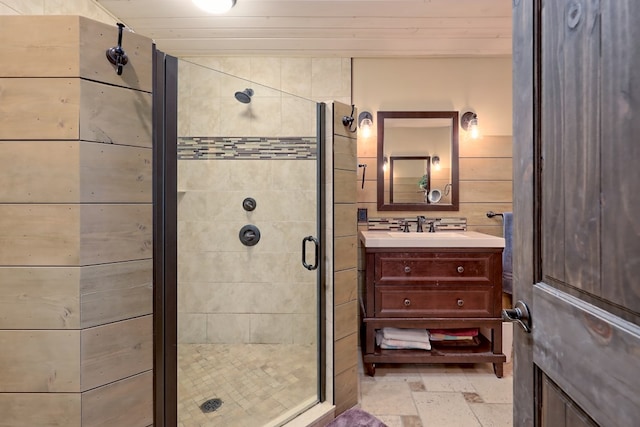 bathroom featuring vanity, an enclosed shower, and wood ceiling