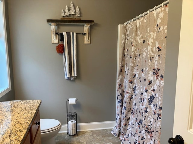24 Pauls Ct, Blairsville, GA 30512 - bathroom with toilet, stone finish flooring, curtained shower, baseboards, and vanity