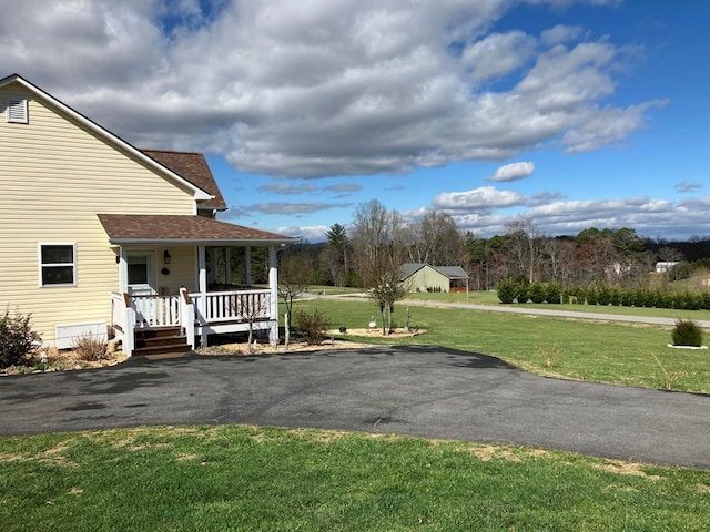 24 Pauls Ct, Blairsville, GA 30512 - exterior space featuring a porch, a yard, driveway, and a shingled roof